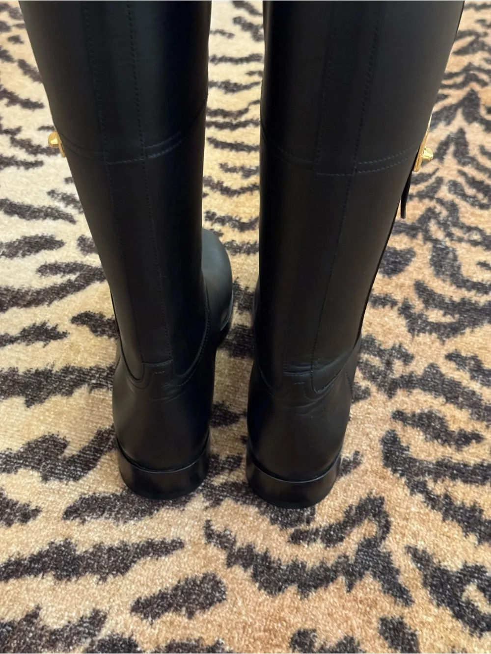 GUCCI Women’s Black Leather Knee-High Riding Boots with Gold Buckle